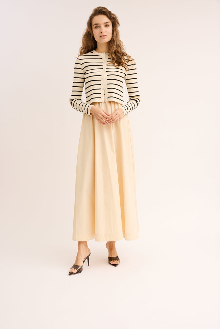 Model wearing the Mix Media Striped Cotton Dress & Cardigan Set in Ivory.