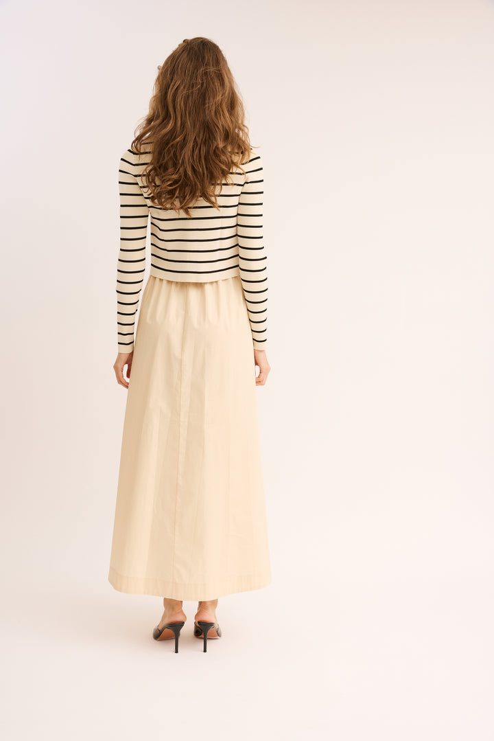 Model showing the back of the Mix Media Striped Cotton Dress & Cardigan Set in Ivory.