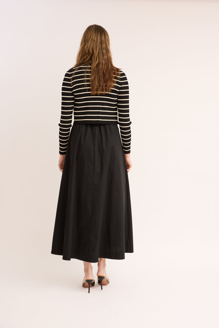 Model showing back of Mix Media Striped Cotton Dress & Cardigan Set in black.