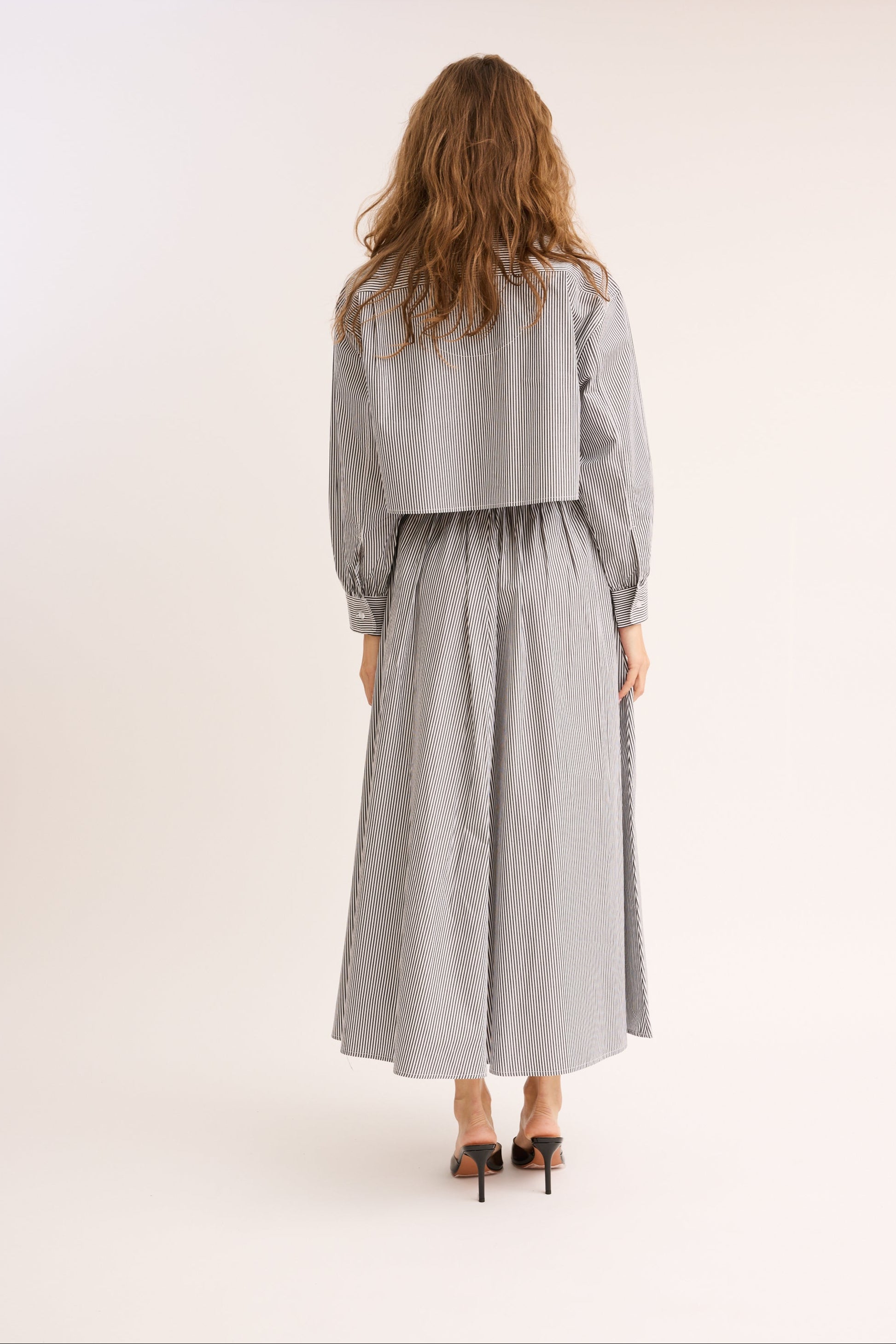 Model wearing the Striped Cinched Poplin skirt. 