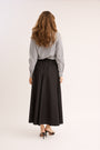 model showing the back of the Relaxed Cotton Drawstring Skirt.
