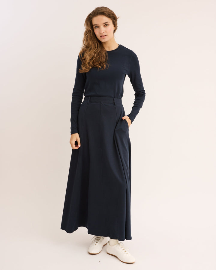 Model wearing the Navy Pima Paneled Skirt.
