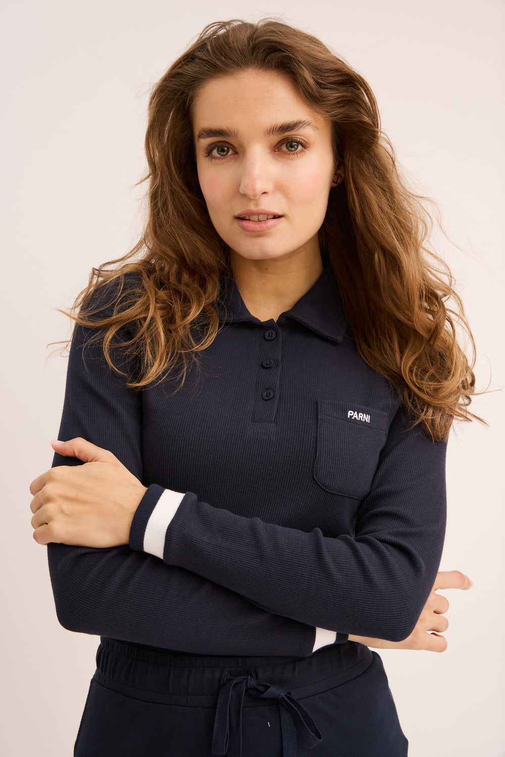 Woman wearing navy Classic Parni Polo. 