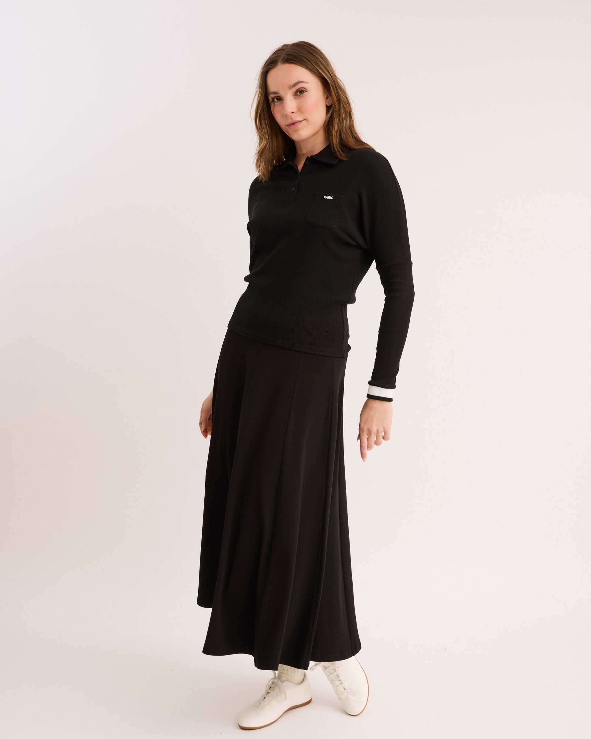 Model wearing the High Waisted Panel Skirt in Black.