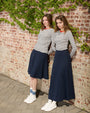 Two girls, one wearing the Everyday Pima Short Skirt.