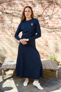 Woman wearing the navy Classic Parni Emblem Dolman Tee. 