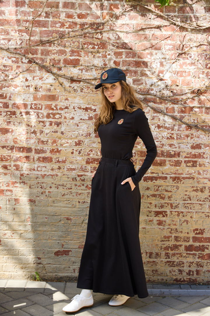 Model wearing the black Pima Paneled Skirt.