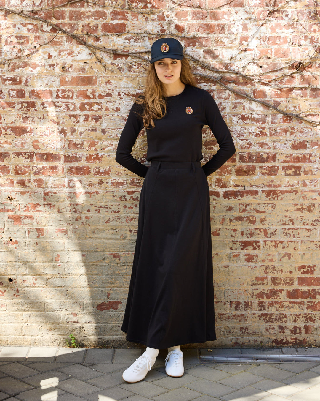 Model wearing the black Pima Paneled Skirt. 