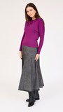 Model wearing the Rhinestone Henley Dolman Sleeve Top in Megenta.