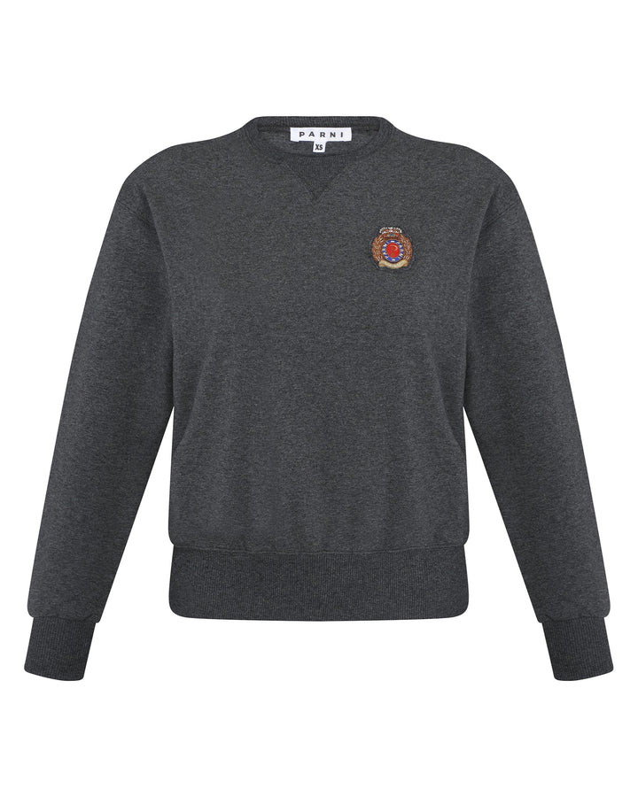 Dark gray sweater with a logo on the chest against a white background