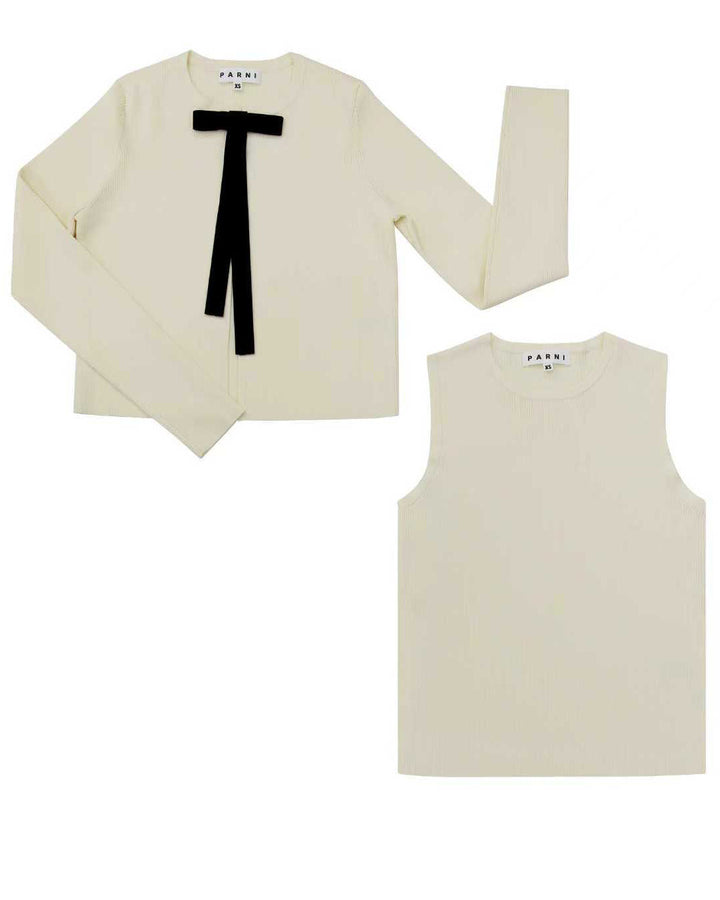 White long-sleeve top with black bow and white tank top on a white background