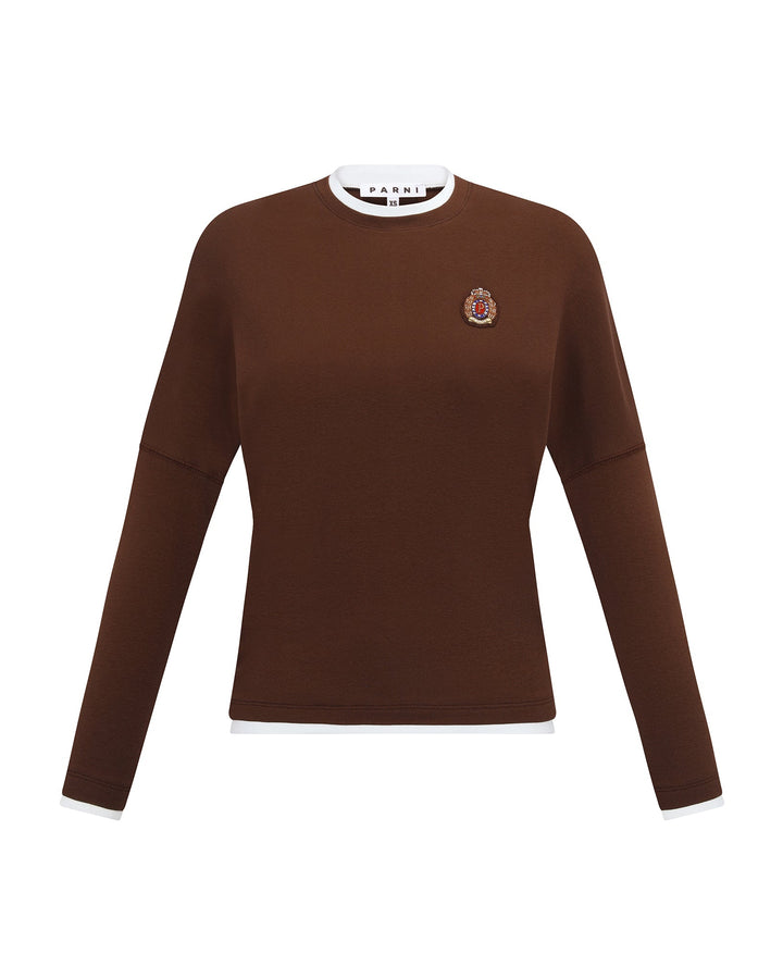 Brown Tshirt with a small emblem on a white background