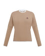 Beige long-sleeve shirt with a small logo on a white background