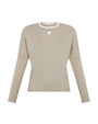 Beige long-sleeve top with a logo on a white background