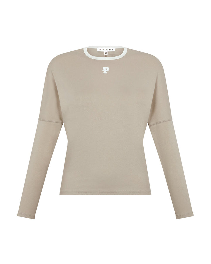 Beige long-sleeve top with a logo on a white background
