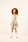 Girl wearing the grey Girls High Waisted Varsity Skirt.