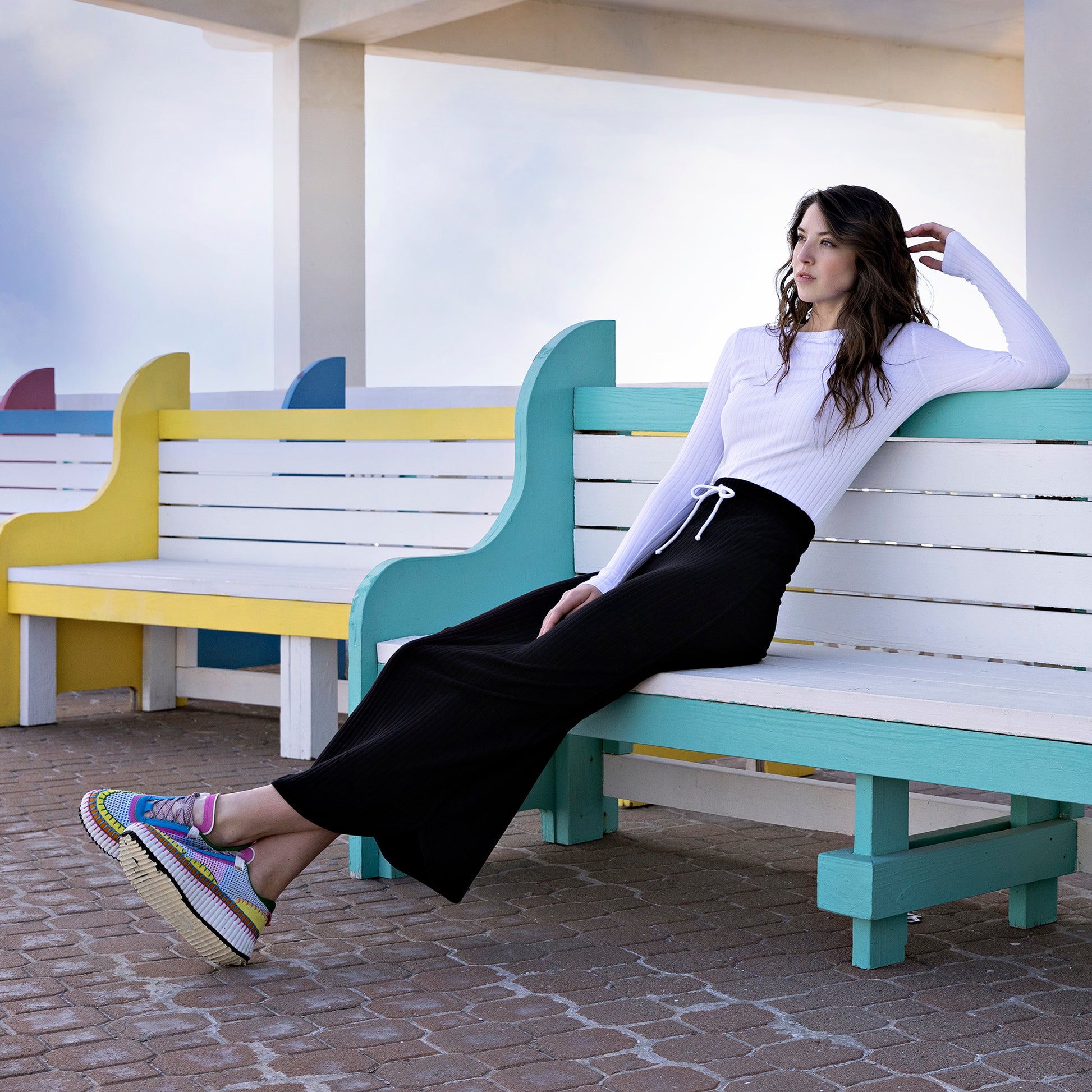Model wearing the Midi Tie Skirt in black.