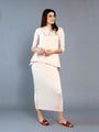 Model wearing the Broadway Skirt in nude.