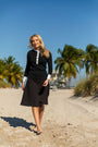 Model wearing the Havana Skirt in Black.